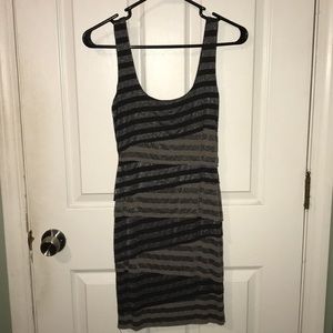 Sleeveless, tiered fitted dress.